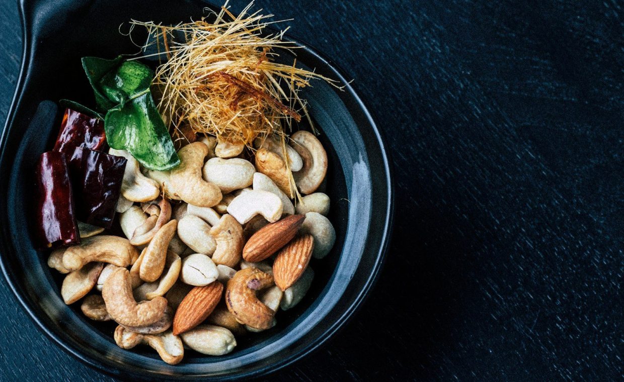 assorted-color nut on vase closeup photo