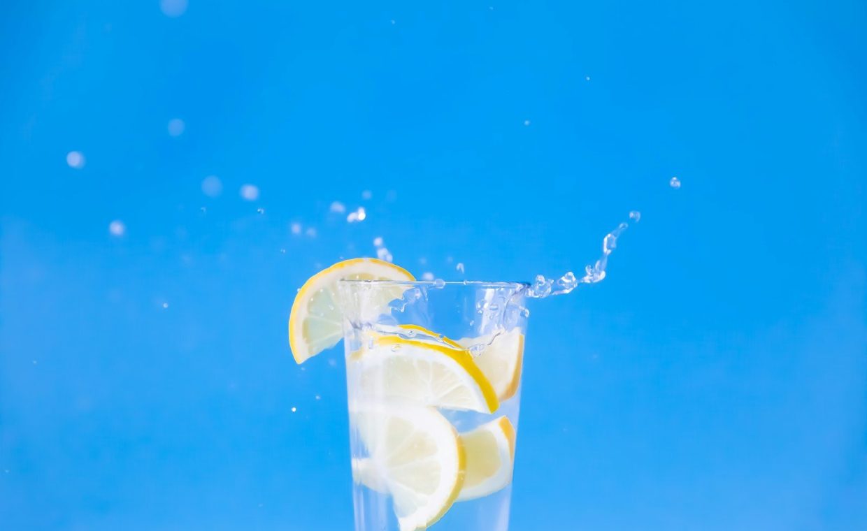 clear drinking glass with yellow liquid